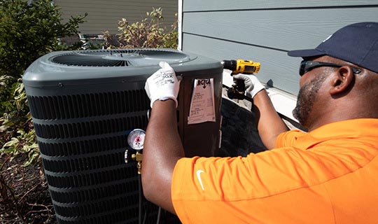 Airtron Technician Servicing On Air Conditioner