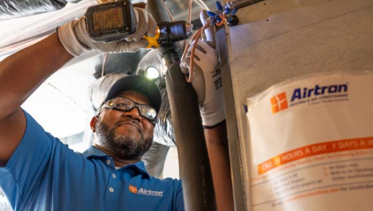 Technician working on furnace