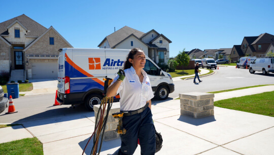 Airtron air conditioning technician arriving for residential HVAC service call