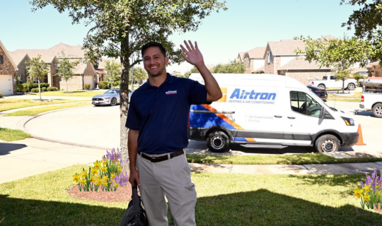 Friendly Airtron technician arriving at customer's home for spring promotion