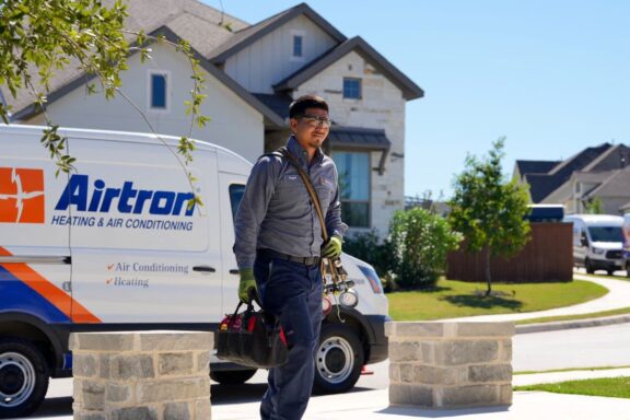 Airtron service technician making an HVAC home visit in San Antonio