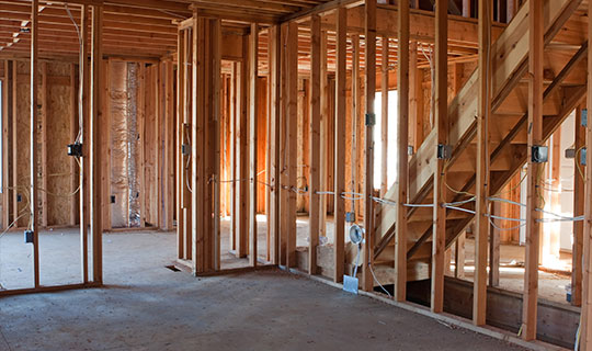 unfinished construction interior, wood wall studs