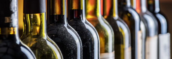 close up of a row of wine bottles